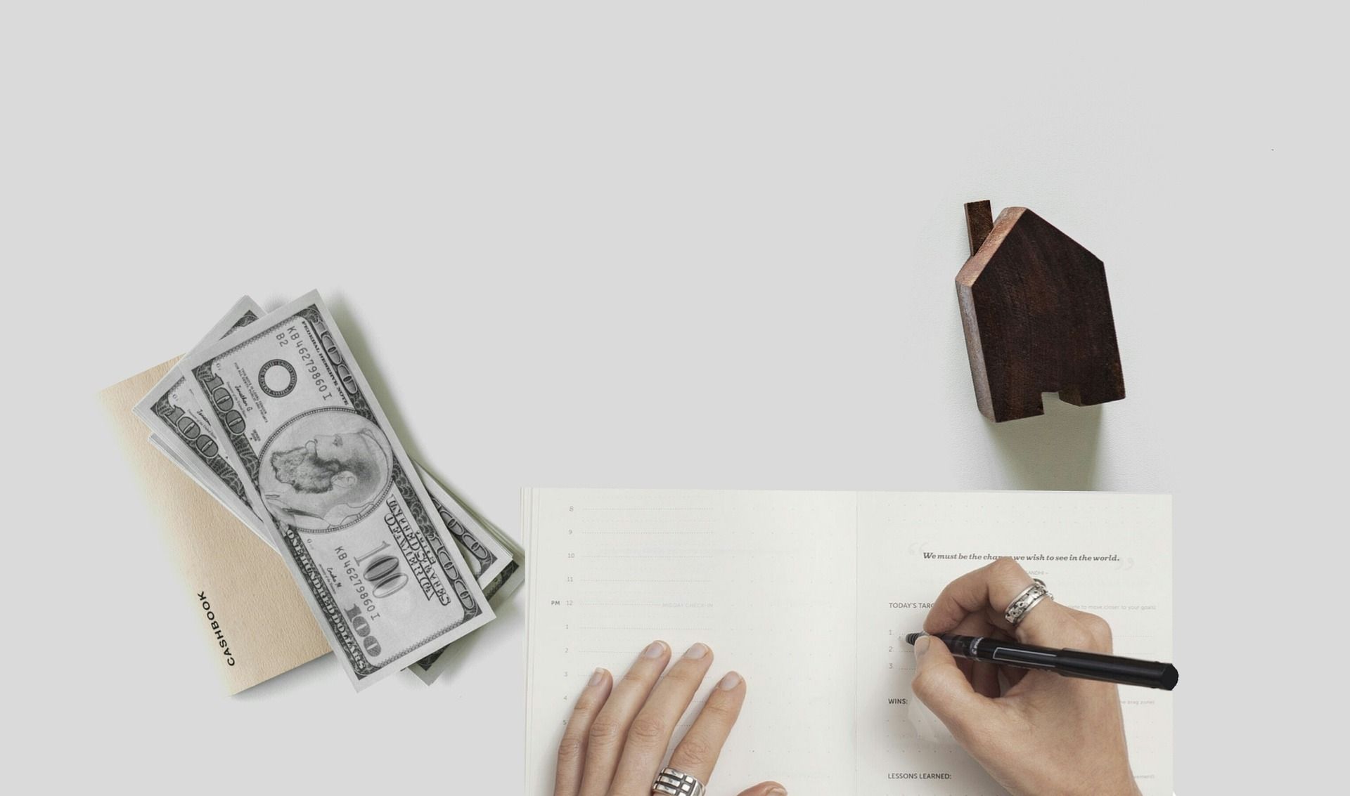 A house and euro notes representing cashing out to a bank account