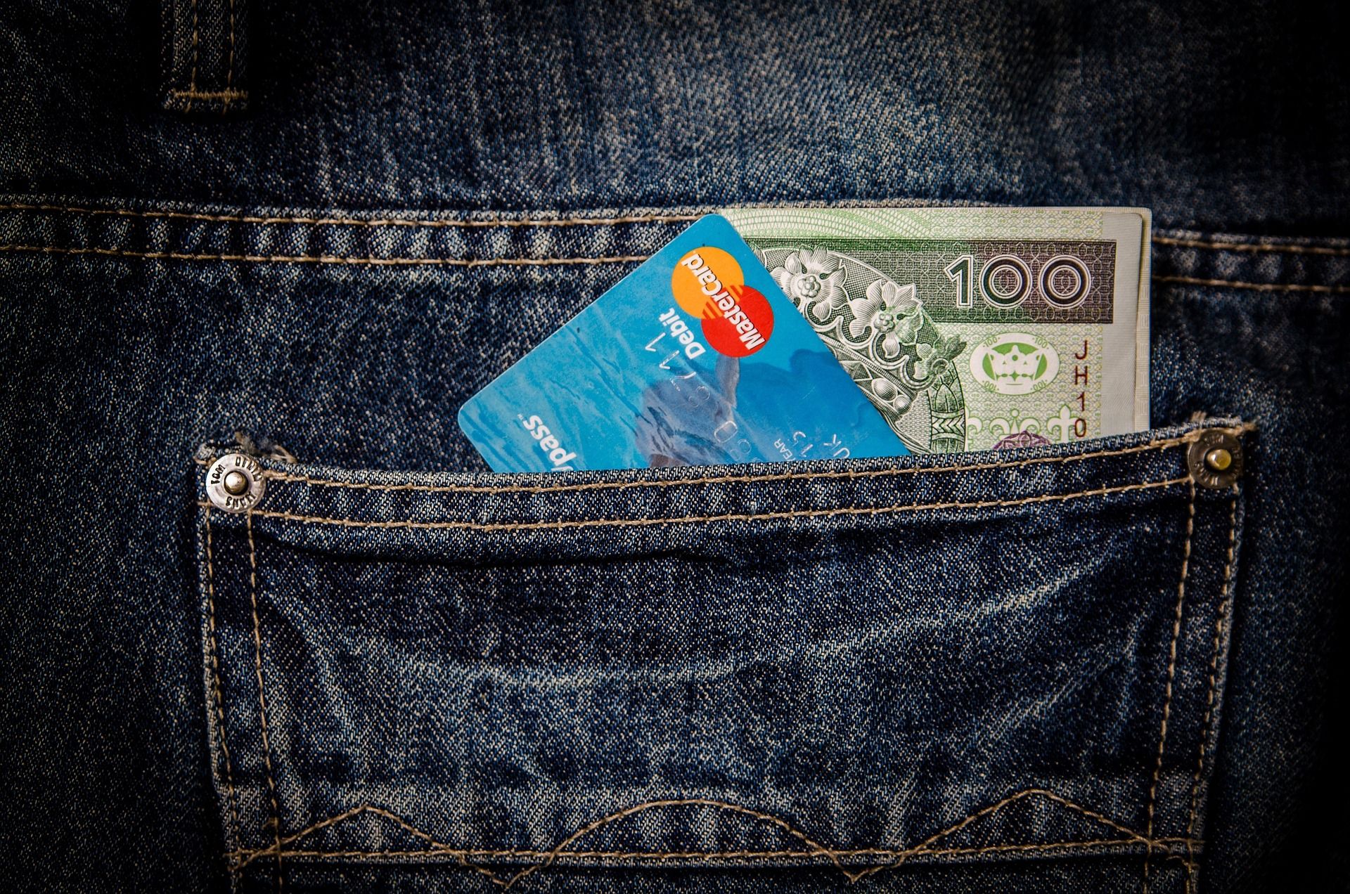 A bank card on top of banknotes