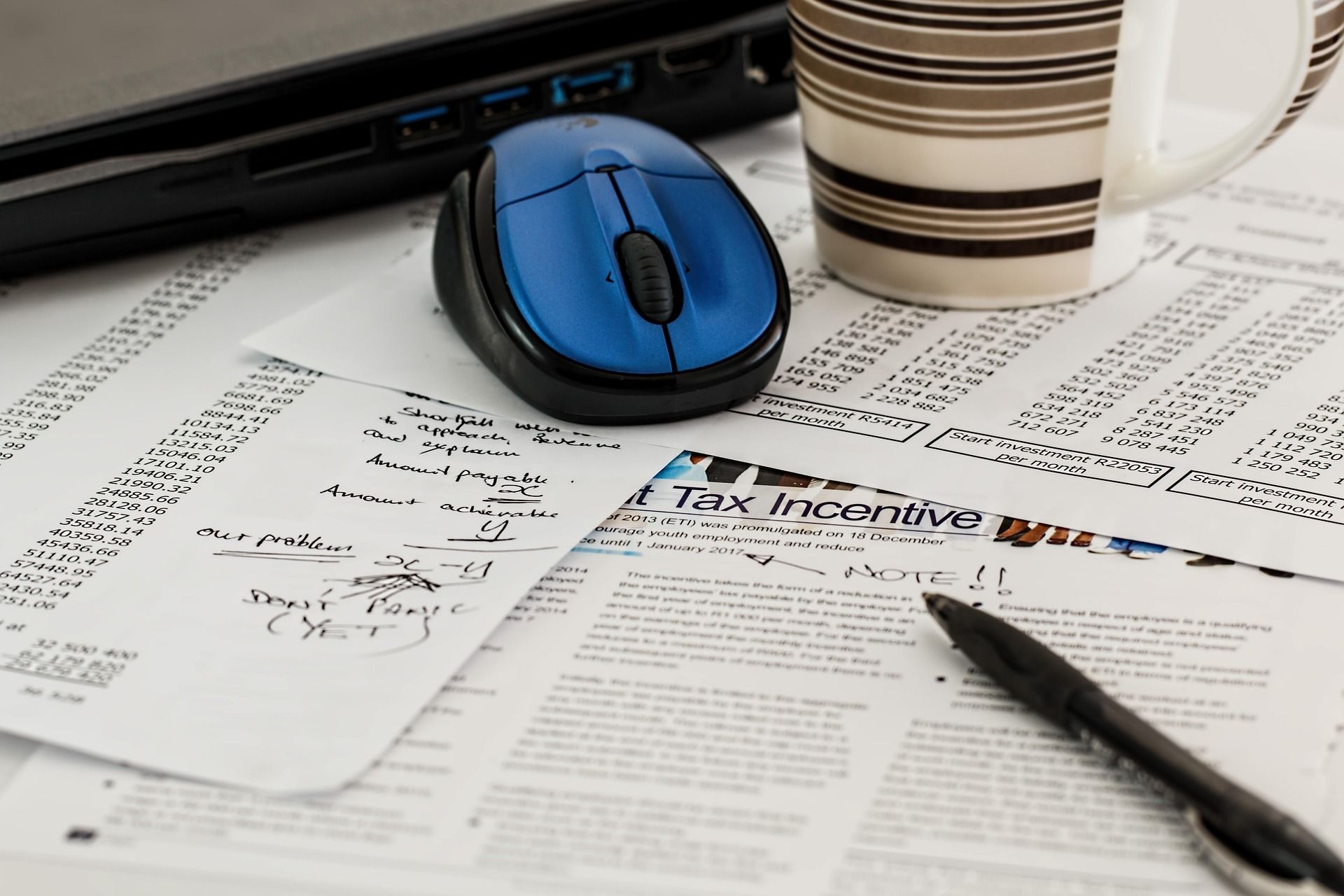 Irish tax forms and a pen on a desk